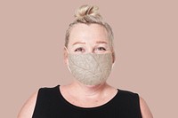 Mature woman wearing mask for Covid-19 prevention campaign