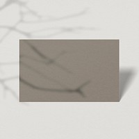 Blank brown business card with branch shadow