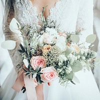 Beautiful bride holding flower bouquet, wedding aesthetic