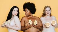 Diverse nude women holding fruits over their breasts