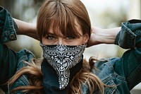 Woman covering her mouth with a bandana during coronavirus outbreak 