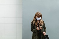 Woman wearing a face mask in public during coronavirus pandemic