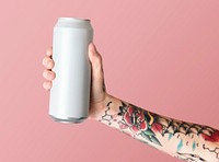 Hand holding a white aluminum can