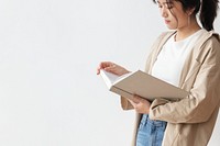 Asian woman reading a book 