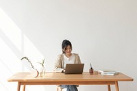 Happy Asian woman working from home 
