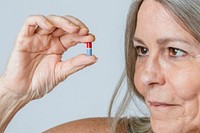 Senior taking a pill for viral disease