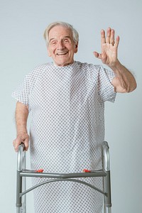 Senior patient with a zimmer frame waving his hand
