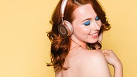 Woman listening to music through her headphones
