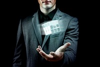 Businessman holding innovative combination puzzle cube 