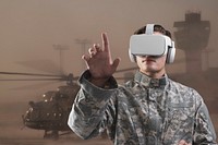 Military in VR headset touching virtual screen for simulation training military technology