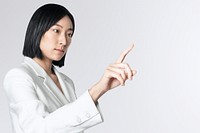 Futuristic digital presentation by an Asian businesswoman