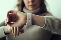 Woman looking at smartwatch wearable technology