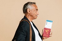 Senior mixed Indian man boarding the plane