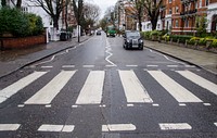 Zebra crossing in england with cars photo, free public domain CC0 image.