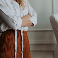 Confident woman in fashion industry standing with arm crossed