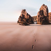 Beautiful beach scenery with footprints in the sand