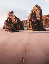 Beautiful beach scenery with footprints in the sand