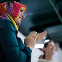 Ambassador arabian woman clapping her hands