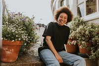 Happy woman sitting in the garden