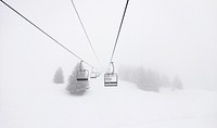 Ski lifts in a snowy resort. Original public domain image from <a href="https://commons.wikimedia.org/wiki/File:Bondinho_em_Morillon.jpg" target="_blank">Wikimedia Commons</a>