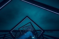 Modern geometric neon bridge architecture at night on walkway, High Trestle Trail Bridge. Original public domain image from Wikimedia Commons