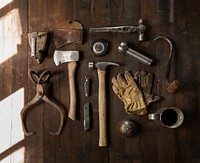 Carpenter toolkit displayed showing tools like hammer, axe, box cutter, iron and flashlight. Original public domain image from <a href="https://commons.wikimedia.org/wiki/File:Toolkit_and_tools_(Unsplash).jpg" target="_blank">Wikimedia Commons</a>