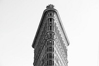 Black and white photo looking up at the Flatiron Building in New York City. Original public domain image from Wikimedia Commons