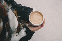 Person holding a cup of hot chocolate in winter. Original public domain image from <a href="https://commons.wikimedia.org/wiki/File:Brigitte_Tohm_2017_(Unsplash).jpg" target="_blank">Wikimedia Commons</a>