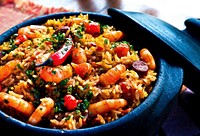Pot of Spanish paella with shrimp, rice, sausage, and peppers for dinner. Original public domain image from <a href="https://commons.wikimedia.org/wiki/File:Spanish_Paella_(Unsplash).jpg" target="_blank" rel="noopener noreferrer nofollow">Wikimedia Commons</a>