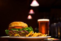 Burger and beer in a pub. Original public domain image from <a href="https://commons.wikimedia.org/wiki/File:Eugene,_United_States_(Unsplash).jpg" target="_blank">Wikimedia Commons</a>
