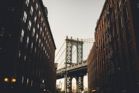 View of the Manhattan Bridge in between two New York City apartment buildings. Original public domain image from Wikimedia Commons