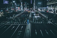 A crowded crosswalk in Tokyo at night. Original public domain image from Wikimedia Commons