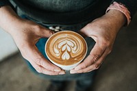 Man holding coffee cup. Original public domain image from <a href="https://commons.wikimedia.org/wiki/File:Nathan_Dumlao_2017-05-26_(Unsplash).jpg" target="_blank">Wikimedia Commons</a>