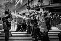 Grayscale photo of police riot team on pedestrian lane. Original public domain image from Wikimedia Commons