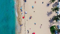An aerial shot of tourists sunbathing on the sand and swimming in the ocean. Original public domain image from <a href="https://commons.wikimedia.org/wiki/File:Golden_beach_in_bird%27s-eye_view_(Unsplash).jpg" target="_blank" rel="noopener noreferrer nofollow">Wikimedia Commons</a>