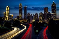 City buildings during night time. Original public domain image from <a href="https://commons.wikimedia.org/wiki/File:Jackson_Street_Bridge,_Atlanta,_United_States_(Unsplash_vXtX07KVcE8).jpg" target="_blank">Wikimedia Commons</a>