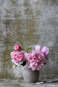 Mini pink flower bouquet in gray vase with textured wall background in Spring. Original public domain image from <a href="https://commons.wikimedia.org/wiki/File:Peony_vase_(Unsplash).jpg" target="_blank" rel="noopener noreferrer nofollow">Wikimedia Commons</a>
