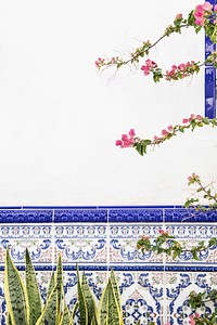 Branches of pink petaled flowers growing pass the white wall. Original public domain image from <a href="https://commons.wikimedia.org/wiki/File:Spain_(Unsplash).jpg" target="_blank">Wikimedia Commons</a>