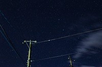 Electric post under starry sky. Original public domain image from Wikimedia Commons