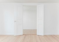 White double door in an empty room painted white. Original public domain image from <a href="https://commons.wikimedia.org/wiki/File:Door_in_a_white_room_(Unsplash).jpg" target="_blank" rel="noopener noreferrer nofollow">Wikimedia Commons</a>