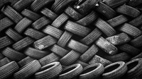 Large heaps of black tires. Original public domain image from <a href="https://commons.wikimedia.org/wiki/File:Black_tire_pattern_(Unsplash).jpg" target="_blank" rel="noopener noreferrer nofollow">Wikimedia Commons</a>
