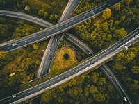 A drone shot of an intersection with an overpasses. Original public domain image from Wikimedia Commons