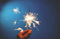 Hand holding a sparkler. Original public domain image from Wikimedia Commons