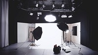 A photographic studio with a backdrop, lights, and softboxes. Original public domain image from <a href="https://commons.wikimedia.org/wiki/File:Photographic_studio_(Unsplash).jpg" target="_blank" rel="noopener noreferrer nofollow">Wikimedia Commons</a>