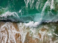Wave crashing on the sandy beach at Balboa Island. Original public domain image from <a href="https://commons.wikimedia.org/wiki/File:Wave_crashing_(Unsplash).jpg" target="_blank" rel="noopener noreferrer nofollow">Wikimedia Commons</a>