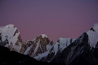Purple evening sky over snow-capped mountains. Original public domain image from Wikimedia Commons