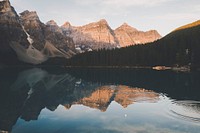 Ripples on the surface of a lake with a view on tall mountains. Original public domain image from Wikimedia Commons