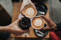 Three people cheering with iced coffee and lattes at Verve Coffee. Original public domain image from Wikimedia Commons