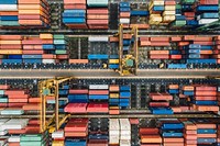 A drone shot of colorful shipping containers in a terminal in Singapore. Original public domain image from <a href="https://commons.wikimedia.org/wiki/File:Container_terminal_from_above_(Unsplash).jpg" target="_blank" rel="noopener noreferrer nofollow">Wikimedia Commons</a>