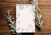 Doodle patterned notebook on a wooden table